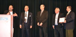 Bob Dwyer describes the achievements of the IntelliTec College carbon monoxide awareness program to attendees at the HVAC Excellence annual educational conference. Shown from left are Michael Schranz, Charles Fonda, Don Piano, and Howard Weis, executive vice president, HVAC Excellence.