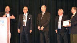 Bob Dwyer describes the achievements of the IntelliTec College carbon monoxide awareness program to attendees at the HVAC Excellence annual educational conference. Shown from left are Michael Schranz, Charles Fonda, Don Piano, and Howard Weis, executive vice president, HVAC Excellence.