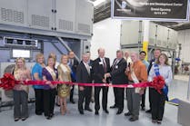 Friedrich Air Conditioning President Chuck Campbell (center left) and Vice President of Engineering David Lingrey (center right) cut the ribbon for the Design and Development Center grand opening, joined by members of the San Antonio Chamber of Commerce. Back row: Friedrich Vice President of Sales and Marketing Wink Chapman. Second row, right: Joe McGuire, president, Association of Home Appliance Manufacturers (AHAM).