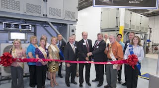 Friedrich Air Conditioning President Chuck Campbell (center left) and Vice President of Engineering David Lingrey (center right) cut the ribbon for the Design and Development Center grand opening, joined by members of the San Antonio Chamber of Commerce. Back row: Friedrich Vice President of Sales and Marketing Wink Chapman. Second row, right: Joe McGuire, president, Association of Home Appliance Manufacturers (AHAM).