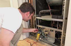 Air conditioning service technican checking voltage on a blower motor Air conditioning service technican checking voltage on a blower motor