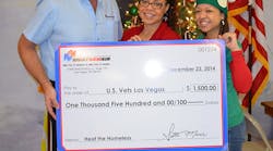 Right Now Air Co-Owner, Scott Meier, presents a check for $1,500 to Krystal Cotton, development and activities coordinator for U.S.VETS &ndash; Las Vegas and Shalimar Cabrera, executive director for U.S.VETS &ndash; Las Vegas at the headquarters on Tuesday, Dec. 23.
