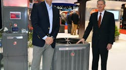 Emerson&apos;s Brent Schroeder, left, and Rheem&apos;s Chris Peel shared the news that Rheem&apos;s Prestige Series would incorporate Emerson Copeland Scroll variable speed compressors. Photo by Terry McIver