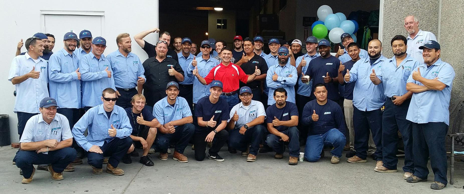 Some of the Action Air team with founder Greg Gill center