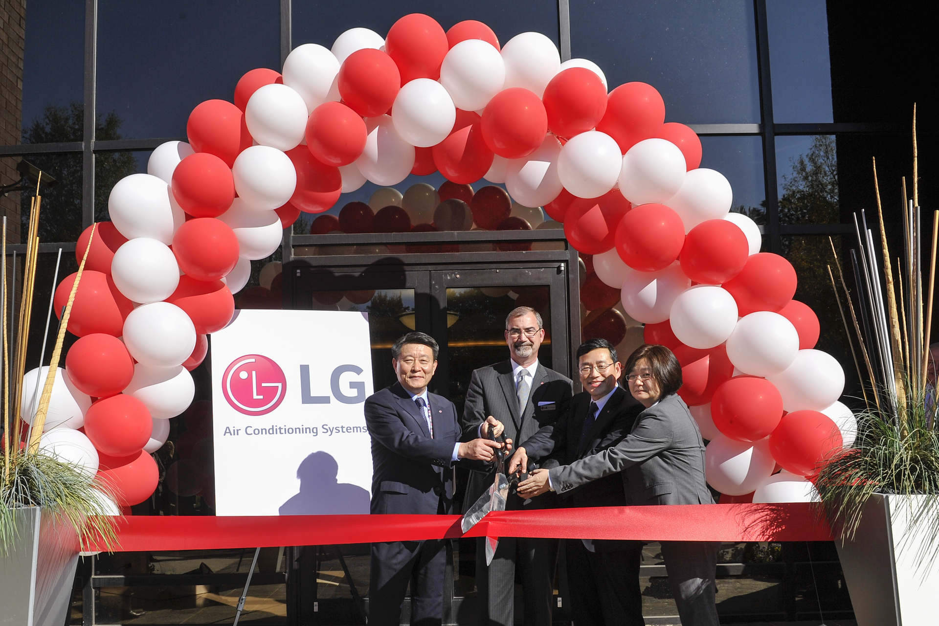 Serving as ribboncutters at the LG opening are from left Mr William Cho president LG Electronics USA Kevin McNamara senior vice president LG Air Conditioning Systems Mr HwanYong Nho presidentCEO Air Conditioning amp Energy Solution Company and Ellen Kim senior vice president and AE leader for LG Electronics USA Photo John Amis