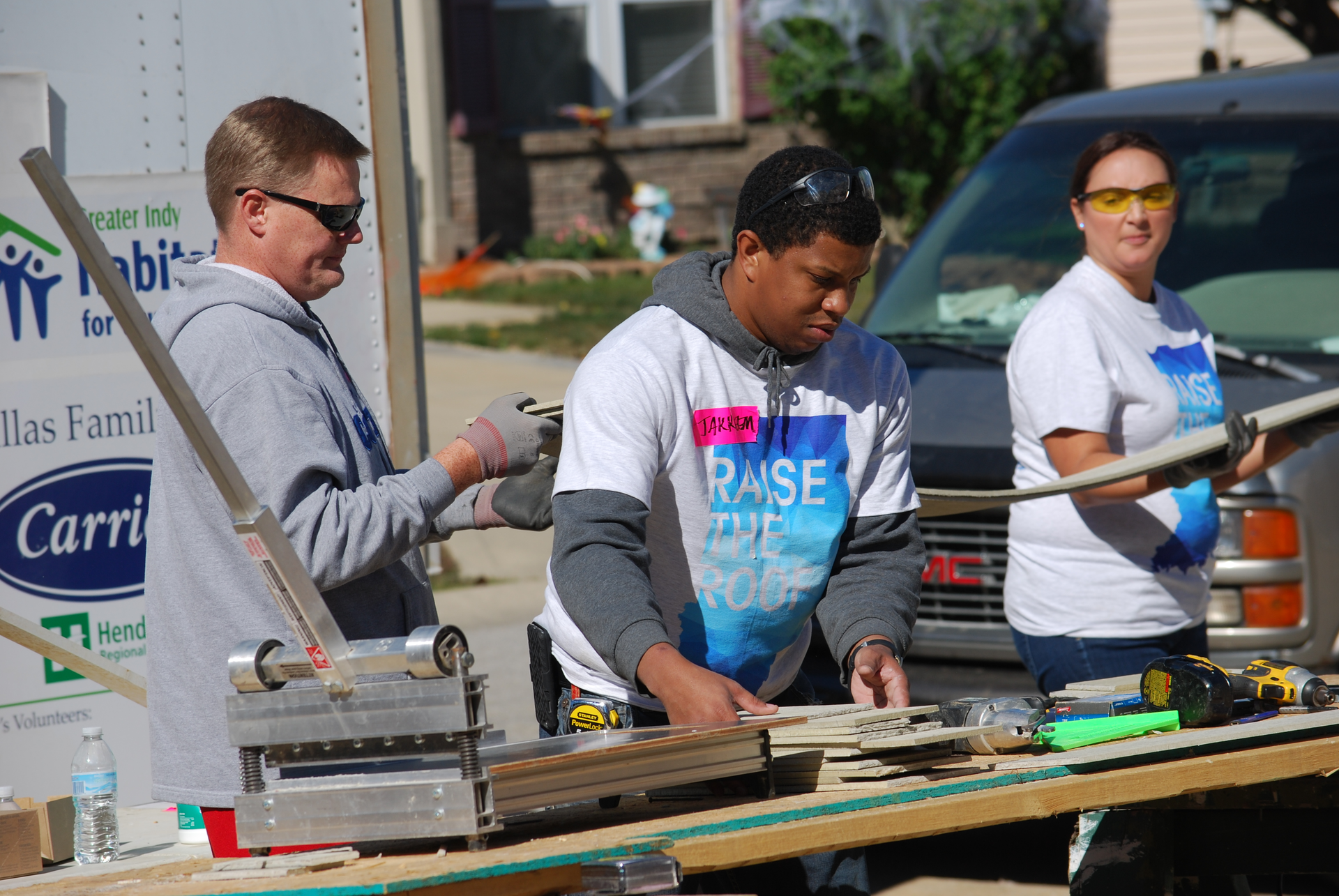 Carrier employees working the job site for Habitat for Humanity