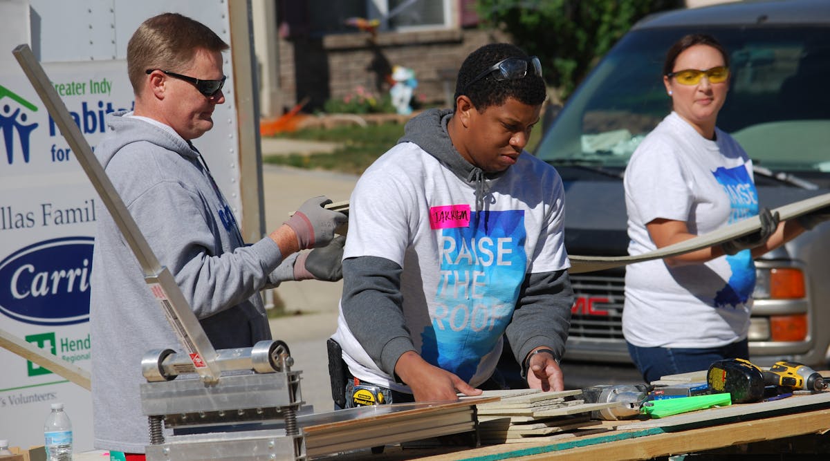 Carrier employees working the job site for Habitat for Humanity.