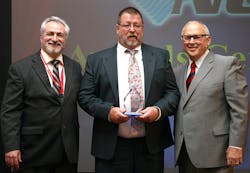 Tom Johnson center of TM Johnson Bros accepts the NCI Chairman39s Award from NCI CEO Dominick Guarino left and President Rob 39Doc39 Falke Tom Johnson center of TM Johnson Bros accepts the NCI Chairman39s Award from NCI CEO Dominick Guarino left and President Rob 39Doc39 Falke