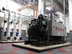 The engineer suggested replacing the screw chillers with a standard watercooled centrifugal chiller and replacing the evaporative condensers with cooling towers Ten or 12in diameter piping and pumps would circulate condenser water from the basement to the rooftop The engineer suggested replacing the screw chillers with a standard watercooled centrifugal chiller and replacing the evaporative condensers with cooling towers Ten or 12in diameter piping and pumps would circulate condenser water from the basement to the rooftop