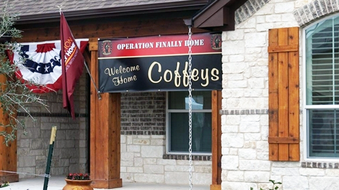 An OFH banner hangs above the entrance to the Coffeys new home