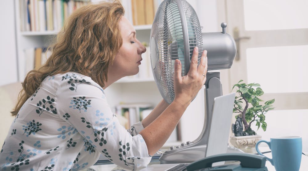 Contractingbusiness 14934 Woman With Fan In Office