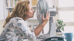 Woman with fan in office.jpg Woman with fan in office.jpg