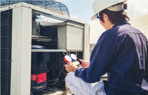 tech checking ac unit.jpg