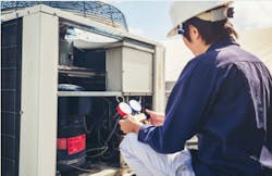 tech checking ac unit.jpg tech checking ac unit.jpg