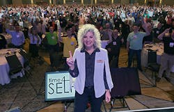 Rebecca Cassel, President of Success Group International, takes a selfie from bi-annual Member Expo stage with over 2,000 attendees in HVAC, Plumbing, Electrical, and Roofing.