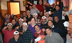 The AMHAC office and field technician team shown at a holiday party. The AMHAC office and field technician team shown at a holiday party.