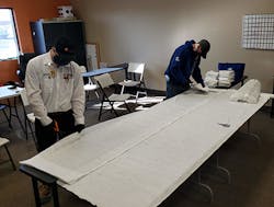 Home service technicians at Comfort Matters in Minneapolis cut filter inserts to be used in masks donated to community seniors and others in congregant settings. Home service technicians at Comfort Matters in Minneapolis cut filter inserts to be used in masks donated to community seniors and others in congregant settings.