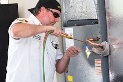 Mike Bateman, Griffin Service’s lead HVACR installer, nitro brazing a new air conditioning installation. Mike Bateman, Griffin Service’s lead HVACR installer, nitro brazing a new air conditioning installation.