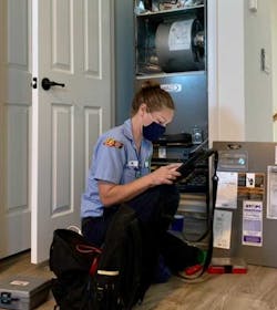 Cool Today’s Amy Castro performing an air-conditioning tuneup. Cool Today’s Amy Castro performing an air-conditioning tuneup.