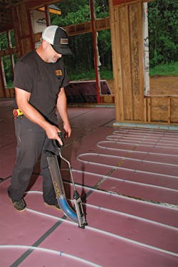 Justin Johnson used a Uponor PEX Foam Stapler to manually set the loops and secure them in place, speeding up the installation process. Uponor Justin Johnson used a Uponor PEX Foam Stapler to manually set the loops and secure them in place, speeding up the installation process. Uponor