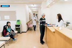 Fig. 4 Upper-Room UV fixtures mounted overhead near a room's ceiling direct germicidal energy upward and outward so that room occupants are safe to go about their normal business. Fig. 4 Upper-Room UV fixtures mounted overhead near a room's ceiling direct germicidal energy upward and outward so that room occupants are safe to go about their normal business.