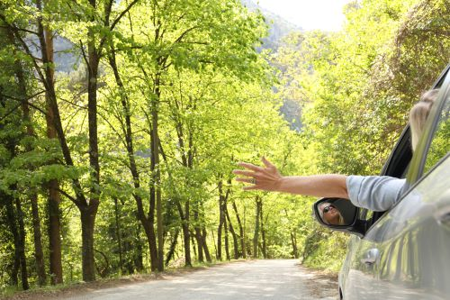 The faster you drive, the more air hits your arm. Air IS heavy.