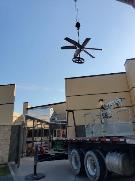 A scissor-lift removed the old fan assembly and helped position its replacement.