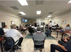 A team training meeting in progress. A new facility will include an area reserved for training. A team training meeting in progress. A new facility will include an area reserved for training.