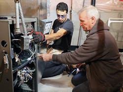 Hurlburt technicians on a jobsite. The majority of Hurlburt’s technicians are NATE-certified. They also undergo weekly communications training to better interact with customers. Hurlburt technicians on a jobsite. The majority of Hurlburt’s technicians are NATE-certified. They also undergo weekly communications training to better interact with customers.