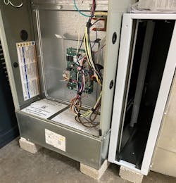 In this image, notice the wall in front of the blower compartment was built back from the front of the furnace into the blower compartment. This setup is different when compared to the typical residential furnace. In this image, notice the wall in front of the blower compartment was built back from the front of the furnace into the blower compartment. This setup is different when compared to the typical residential furnace.