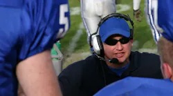 football coach instructs players