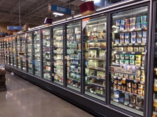 Whenever a case door is opened, the surrounding ambient air enters the refrigerated space, which results in a sizable source of heat gain. This air must then be cooled to match the refrigerated space temperature.