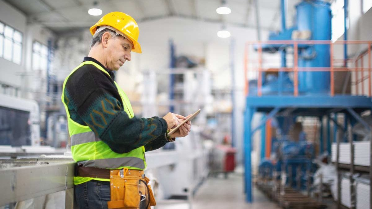HVAC technician using tablet