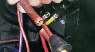 Getting the flushing agent into the lineset: a conical rubber fitting can be wedged into the open lineset and hand-held in position during flushing.
