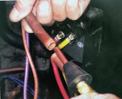Getting the flushing agent into the lineset: a conical rubber fitting can be wedged into the open lineset and hand-held in position during flushing. Getting the flushing agent into the lineset: a conical rubber fitting can be wedged into the open lineset and hand-held in position during flushing.