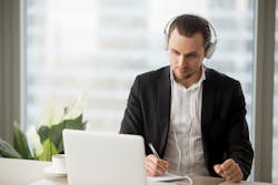 man conducting phone interview headset