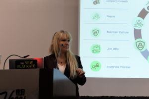 Danielle Putnam, president of The New Flat Rate, listens to questions from 2022 AHR Expo attendees about hiring new people.