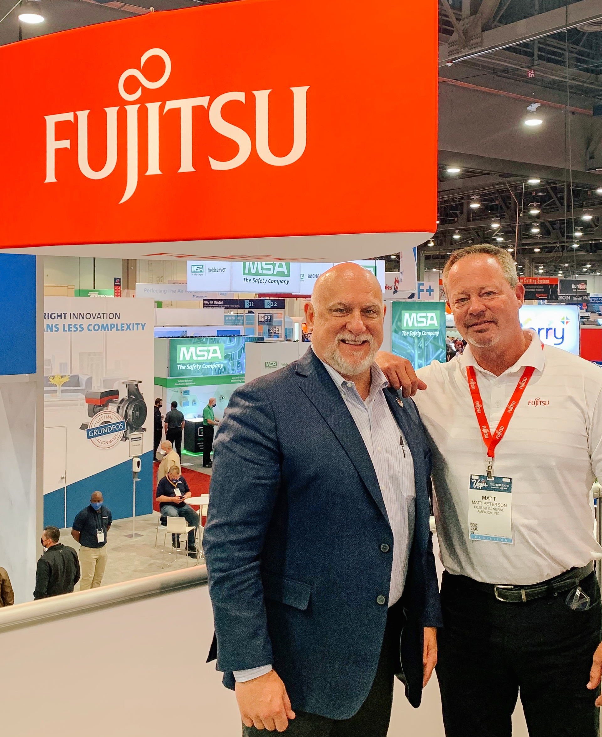 Target Sales President Dale Moody, left, with Fujitsu President and CEO Matt Peterson during the recent AHR EXPO trade show in Las Vegas.