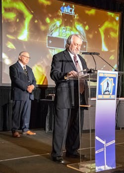NCI CEO Dominick Guarino announces the Contractor of the Year winners as NCI President Rob Falke looks on. NCI CEO Dominick Guarino announces the Contractor of the Year winners as NCI President Rob Falke looks on.