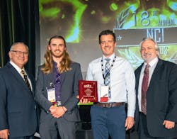 General Manager Tom Hearn (holding award) and Matthew Griswold, accepted the NCI award for Medium-size Contractor of the Year.