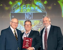 Rob Falke during the 2022 NCI Summit, with Dominick Guarino and an NCI Contractor of the Year, Don Langston, president/CEO of AireRite.
