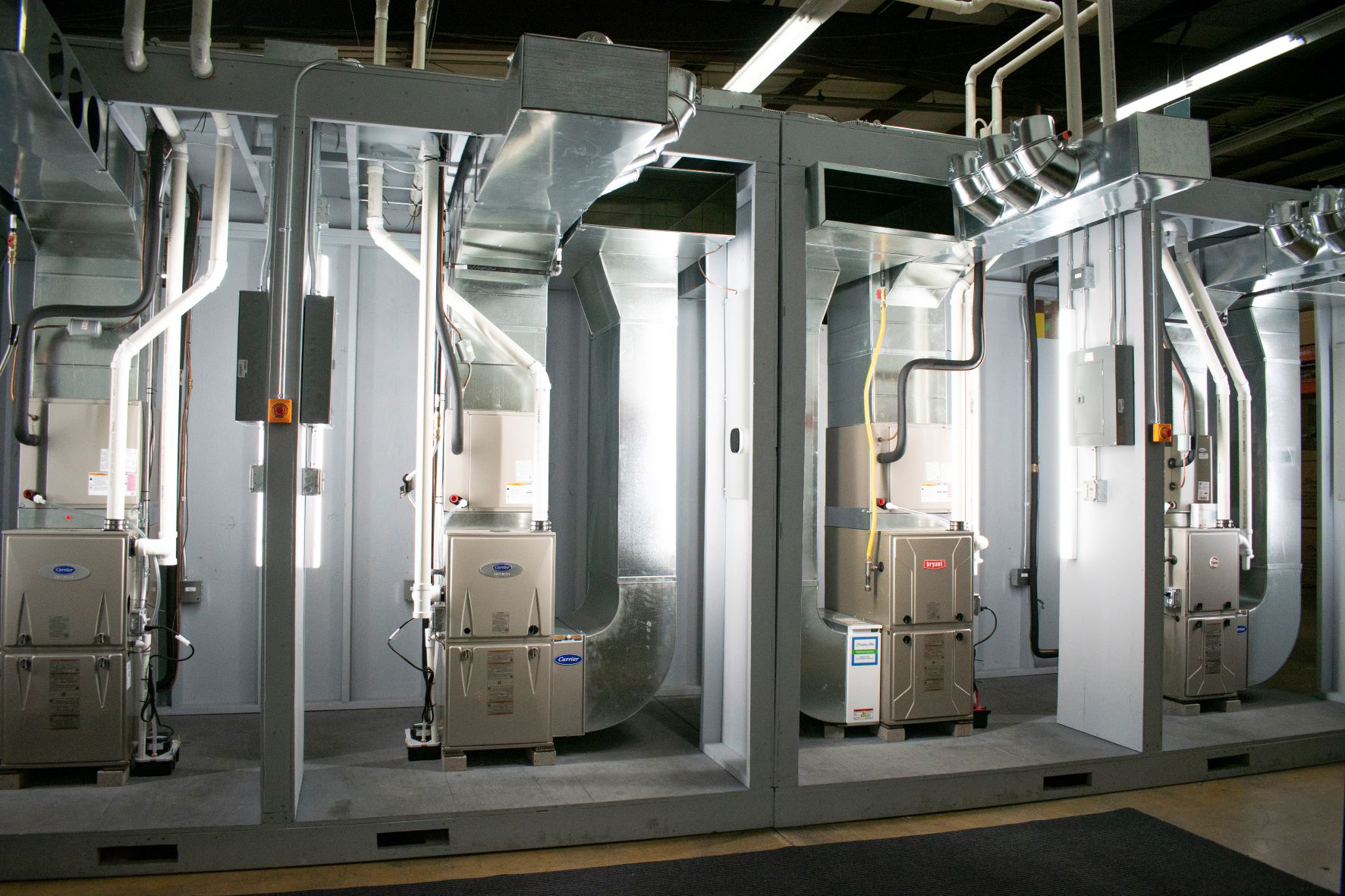 The facility includes a 25-person training classroom and 12 hands-on work stations equipped with live HVAC equipment that technicians will find in a home.