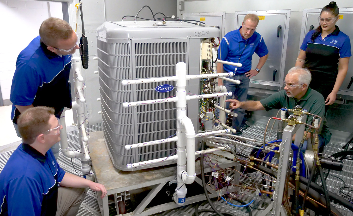 Carrier's Indianapolis engineering team prepare a heat pump for cold climate testing.