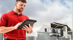 Man Reading Tablet On Rooftop2