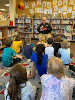 Bill Ronayne reads to school kids as part of the 'Rotary Readers' program. Bill Ronayne reads to school kids as part of the 'Rotary Readers' program.