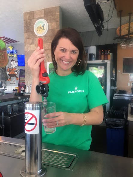Becky Brotherton, director of brand and marketing, RIDGID for Emerson, pours a cold Unplugged Wrench 100 IPA from the limited edition beer tap at the Unplugged Brewing Company.