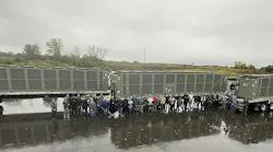 Trane employees outside the new facility with new units ready to go.