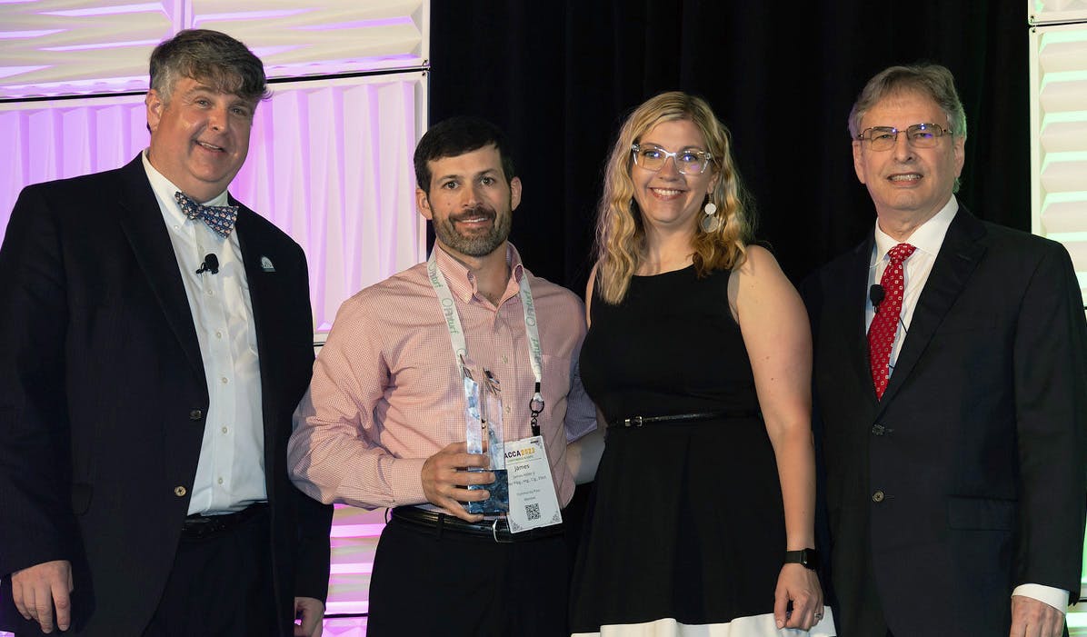 Barton James, left, with representatives from Hiller HVAC during the 2023 ACCA Conference.
