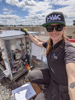 Jessica Bannister prepares to service a rooftop unit, in a photo from one of &apos;HVAC Diaries&apos; episodes.