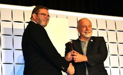 Steve Pape, right, passes the ACCA Chairman's gavel to 2024-25 ACCA Chairman Martin Hoover. Steve Pape, right, passes the ACCA Chairman's gavel to 2024-25 ACCA Chairman Martin Hoover.